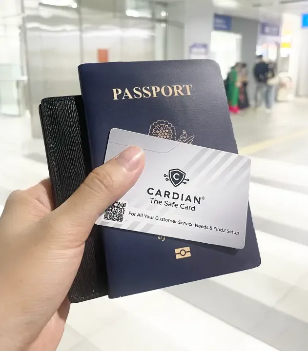 Cardian card held in front of a passport and a wallet