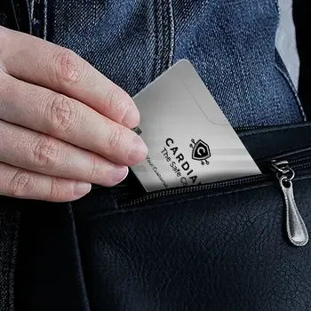 Hand sliding a Cardian card into a bag pocket