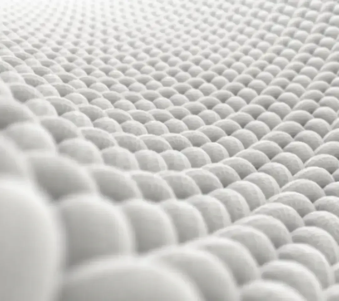 Close-up of a quilted white cotton fabric