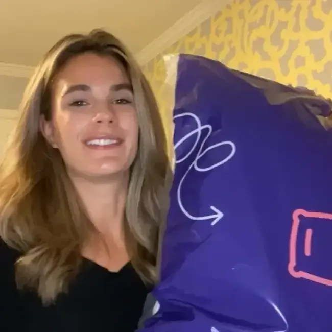 Woman holding a white pillow