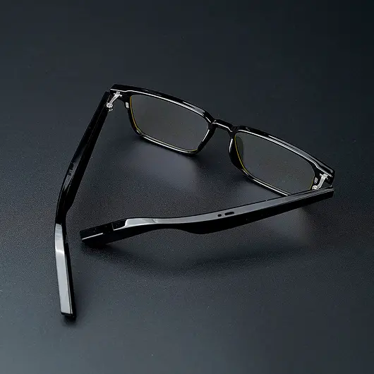Black smart glasses frame seen from the side