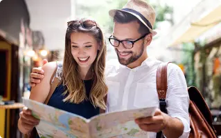 Couple reading a map while traveling